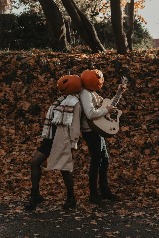 Carved Pumpkins On The Head pose Fall Couple Photoshoot Ideas 5