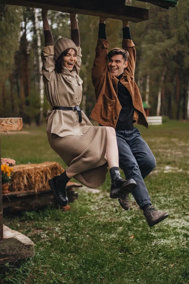 Hanging From Roof pose for Fall Couple Photoshoot Ideas