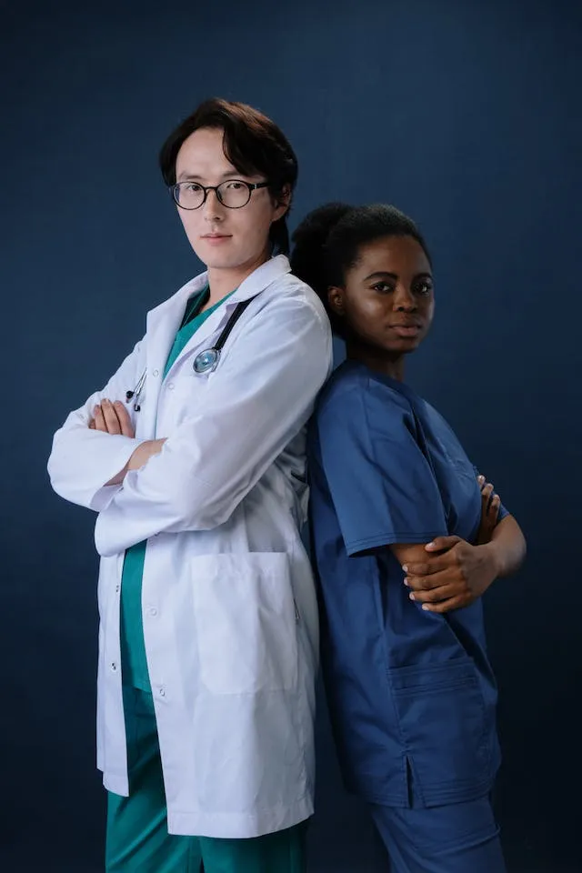 Back-to-back with a doctor pose for Nurse Graduation Photoshoot