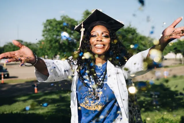 Throwing confetti pose for Nurse Graduation Photoshoot