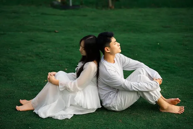 Back-to-Back Couple Pose For Couples Outdoors photoshoot